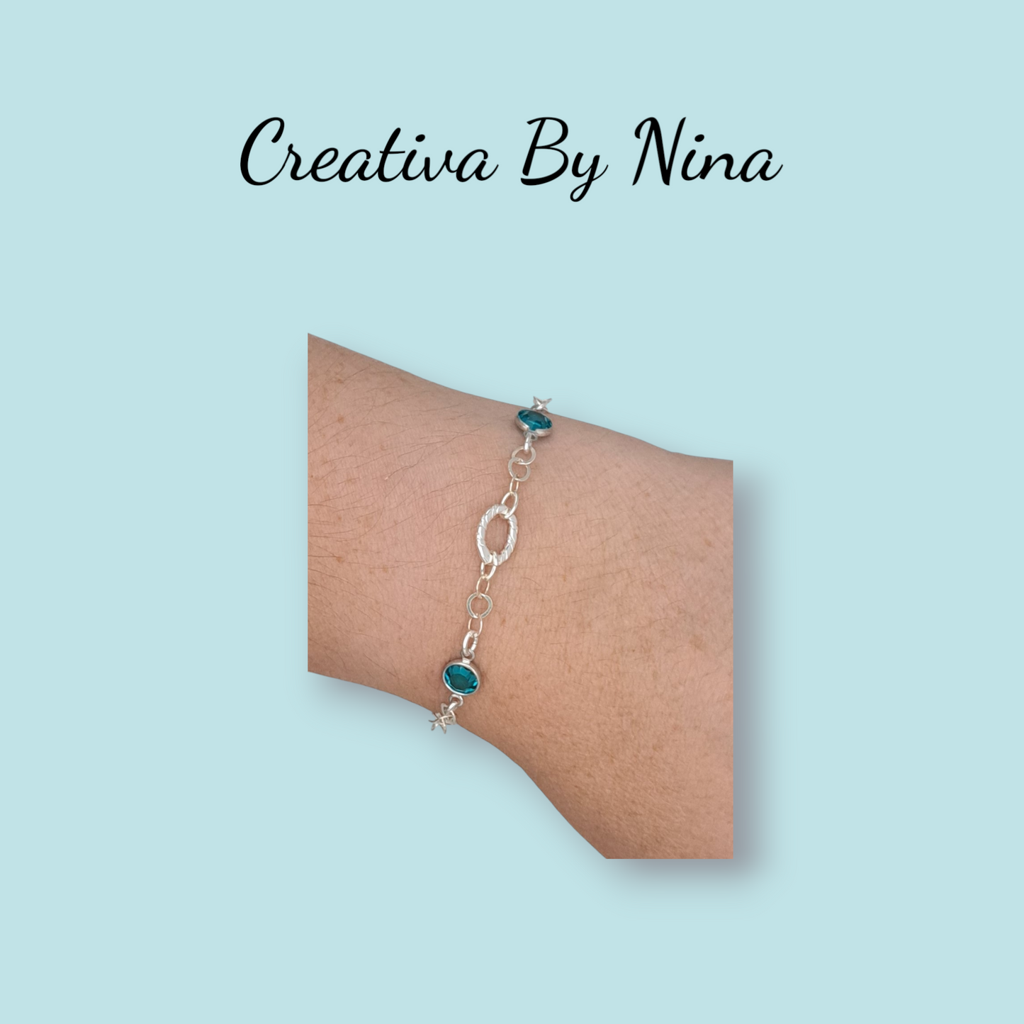 Preciosa bracelet with twisted oval focal link