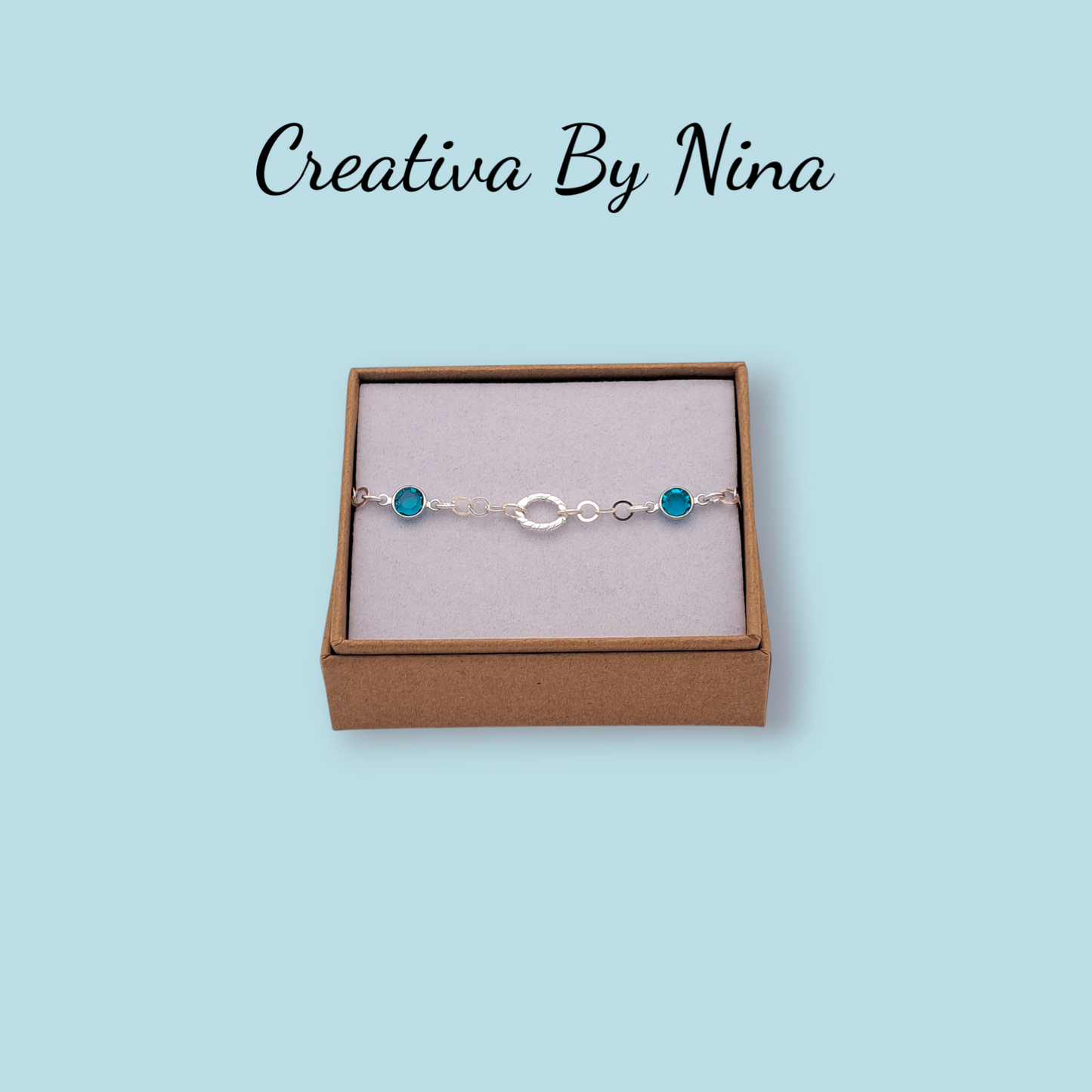 Preciosa bracelet with twisted oval focal link