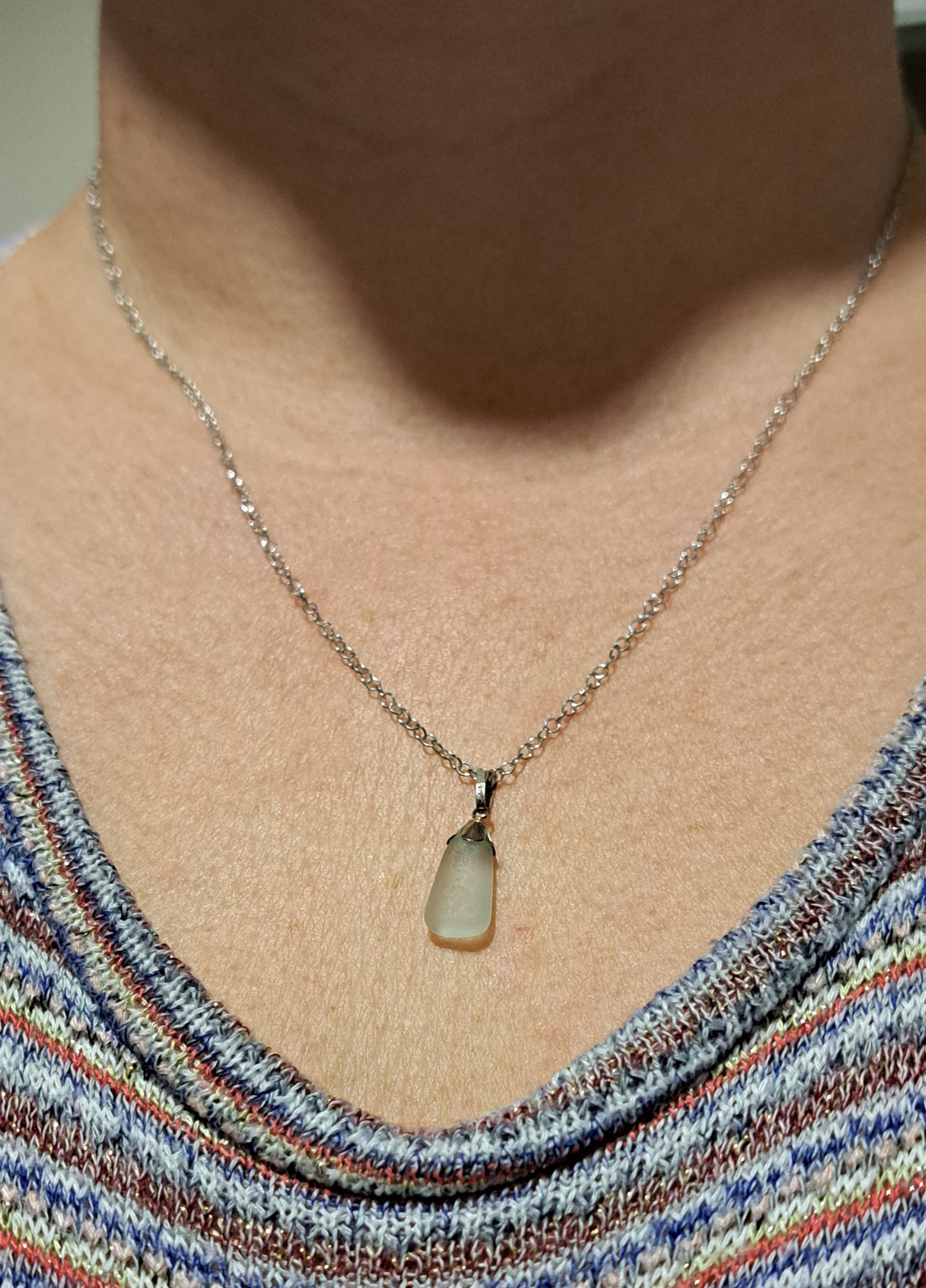 Blue sea glass pendant with sterling silver bell cap