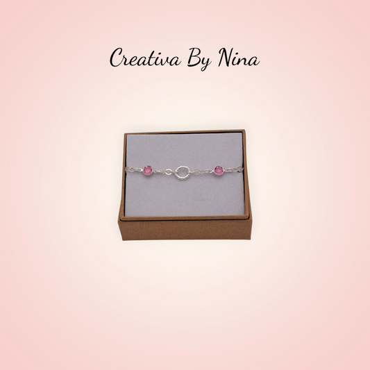Preciosa bracelet with twisted oval focal link